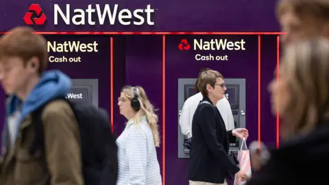 Getty Images People walking outside a NatWest bank