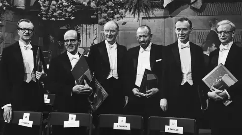 Getty Images Photo of the 1962 Nobel prize winners: Professor Maurice Wilkins, Dr. Max Perutz, Prof. Francis Crick, John Steinbeck, Dr. James Watson, and Dr. John Kendrew