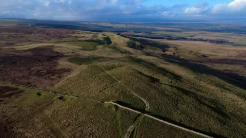 Hope Moor Wind Farm Action Group An aerial view of a rural landscape.