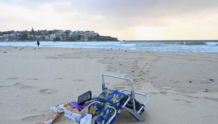 Items lie on the sand following the attack on a Jewish holiday celebration at Sydneys Bondi Beach, in Sydney, Australia on December 15, 2025. — Reuters