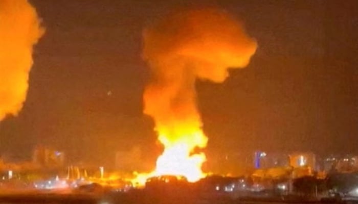 Smoke rises from explosions in Caracas, Venezuela, January 3. — Reuters