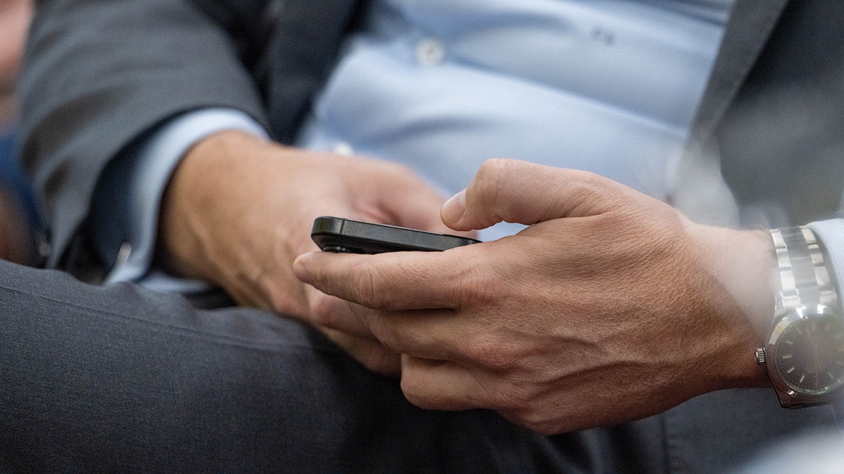 Man checking his phone.